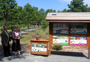 Photo of Carl Schulze and Lynn Fleming unveiling the Forest Pest Kiosk