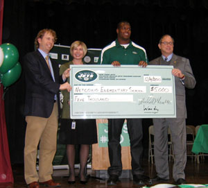 Photo of the Jets awarding check to Netcong Elementary School
