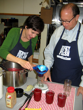 Photo of Nina Rizzo and Secretary Fisher canning cranberry sauce