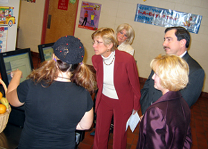 Photo of officials looking at how computerized lunch payment system works
