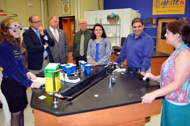 Photo of Woodstown HS Agricultural Education student demonstrating a soil test for dignitaries