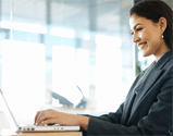 photo of girl by the laptop computer