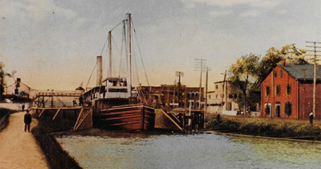 Colorized black and white photo of a boat in the canal
