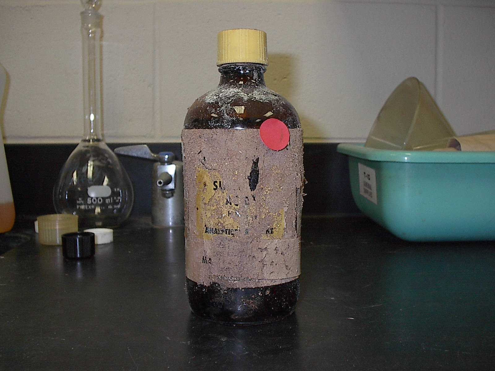 a chemical bottle in a laboratory setting