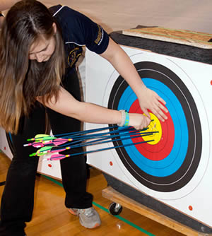 Archer removing arrows from target