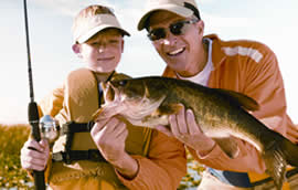 Father and son with bass