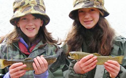 Two girls with trout