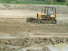 Bulldozing a pond bottom