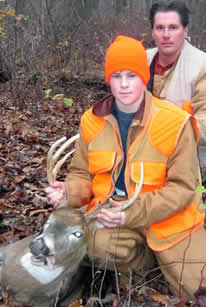 Youth and dad with deer