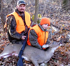 Father and son with deer