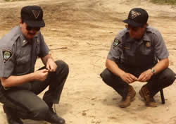 Officers inspect tire tracks