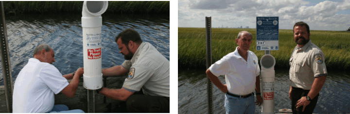 Colby Hawkinson, Park Ranger, and volunteer Les Murray, installing a bin