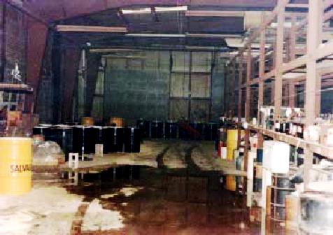 Photo 1 - A view of the warehouse at the Research Organic Inorganic site showing the variety of containerized chemicals during the 1985 emergency clean up effort.
