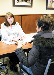 Pat Fleming of the NJ Department of Banking and Insurance assists a consumer.
