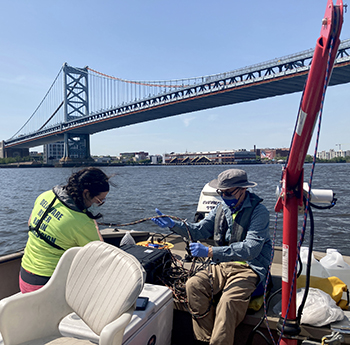 DRBC staff collects a sample from the tidal Delaware River to monitor dissolved oxygen levels. Photo by DRBC.