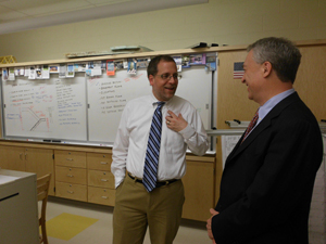 Acting Education Commissioner Chris Cerf talks with pre-engineering teacher Dan Blatt