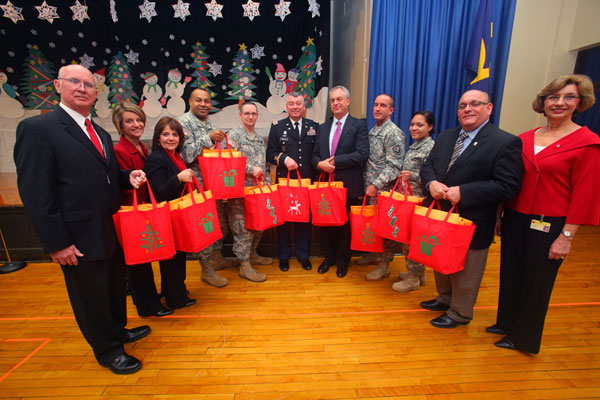 NJ DOE Acting Commissioner Chris Cerf and Col. Mark A. Preston, New Jersey National Guard are presented with nine bags of holiday cards for our U.S. Armed Forces at the Greenwood Elementary School in Hamilton Township today. Hamilton Township school officials, Hamilton Mayor John Bencivengo and members of the New Jersey National Guard took part in the Holiday Greetings for the U.S. Military school assembly. Statewide, school children sent in more than 125,000 cards and letters as part of Governor Christie’s Season of Service.