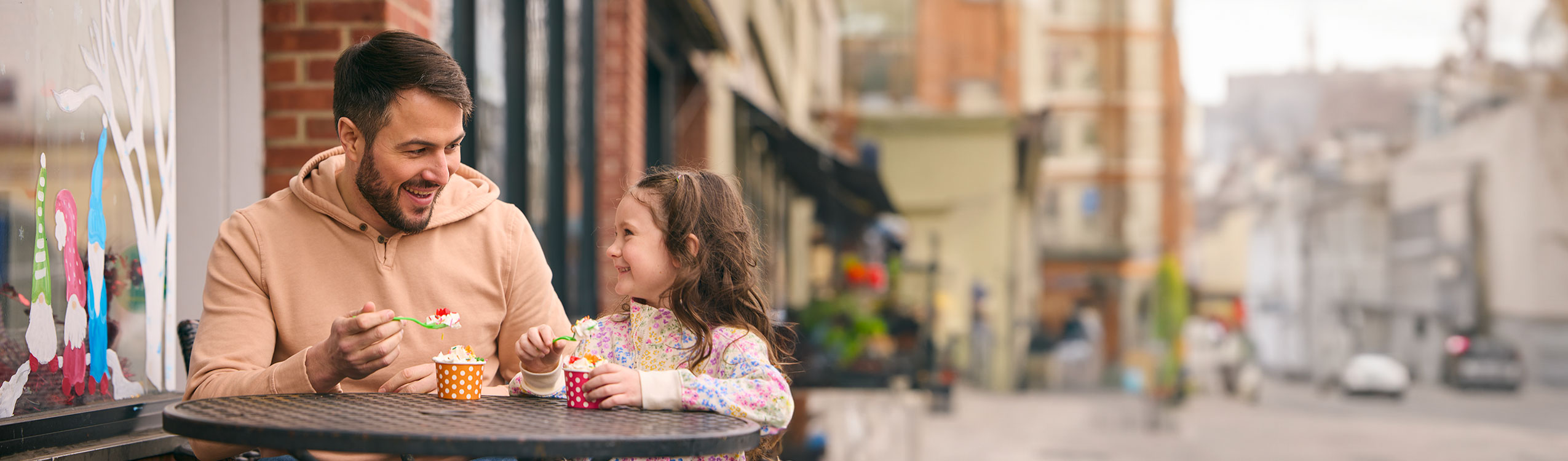 photo: father and daughter enjoying ice cream
