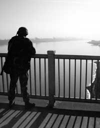 Soldier on Bridge looking down