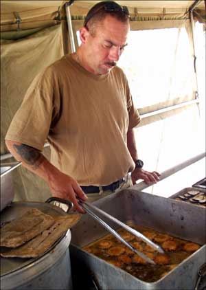 Sgt. Michael Spallina cooking eggplant