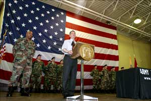 Governor McGreevey, flanked by Citizen-Soldiers from the power plant detail, addresses the audience