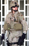 Spc. Charles Snook patrols the provisional governor's palace main entrance while on security detail.  (Click to enlarge)