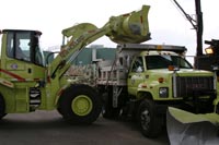 as a winter storm approaches, trucks are loaded with material at a maintenance facility photo