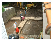 Initial clearing of road construction fill in order to expose buried historic backyard features