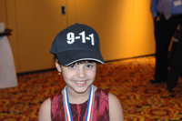 Photo of DaVonne Alexander Wearing her 9-1-1 Hat