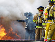 Photo of Men Fighting a Fire