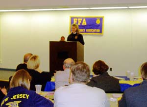 Photo of state officer being evaluated on speech skills