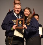 Photo of a presentation of a Member of the Year at 2014 State Convention