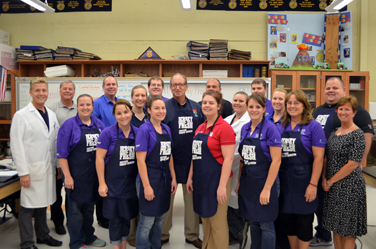 Photo of Secretary Fisher with the CASE Institute Staff and Teachers