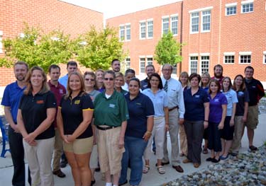 Photo of  the 18 CASE teachers with Secretary Fisher