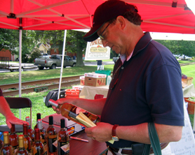 Photo of Secretary Fisher choosing a New Jersey wine to go with his meal