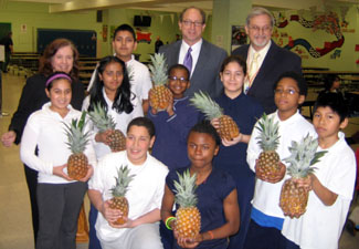 Photo of Barbara Martin, Secretary Fisher, School 11 Principal Chester Kominski and students