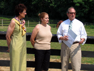 Photo of Karyn Malinowski, Judy Bokman, and Secretary Fisher