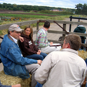 Photo of Secretary Fisher on a hayride at Abma's farm