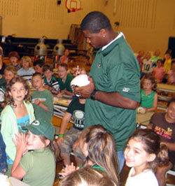 Photo of Adrien Clarke with students at Brielle Elementary School