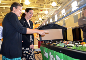 Officials looking at salad bar.