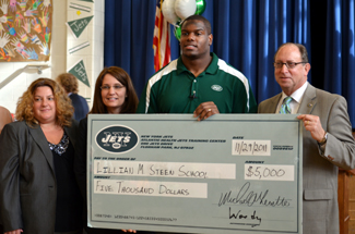 Photo of check presentation to Lillian Steen School