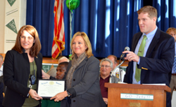 Photo of Assemblywoman Valerie Vanieri-Huttle and her aide Dylan Hawkins with Principal Falco