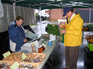 Photo Secretary Fisher at Stony Hill Farm's booth at the Caldwell Farmers Market