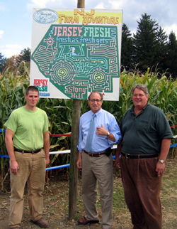 Photo of Dale Davis IV, Secretary Fisher and Dale Davis at entrance to Jersey Fresh maze