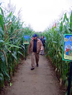 Photo of Secretary Fisher walking through VonThun corn maze