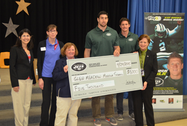 Photo of Glen Meadow Middle School officials accepting an award from the NY Jets