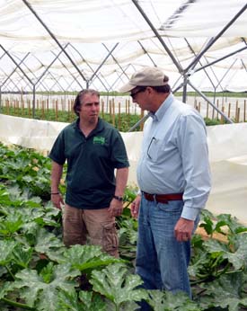 Photo of Jamie Graiff and Secretary Fisher in the high tunnel