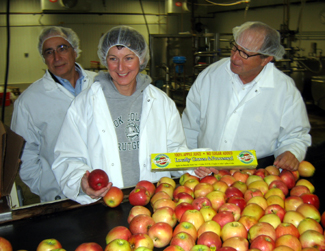 Photo of Fred and Cheryl-Ann Sorbello and Secretary Fisher at the cider mill