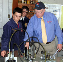 Photo of Secretary Kuperus during hydraulics demonstration