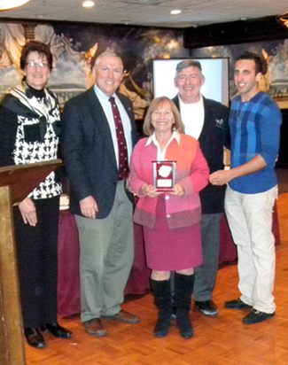 Photo of Landy Family receiving their award